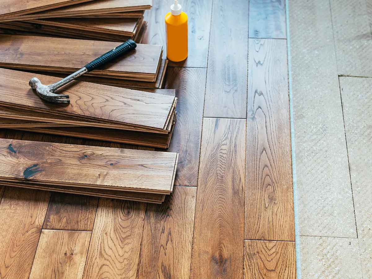 Stack of 3/4-inch solid hardwood planks staged for installation in a Sioux Falls, SD home